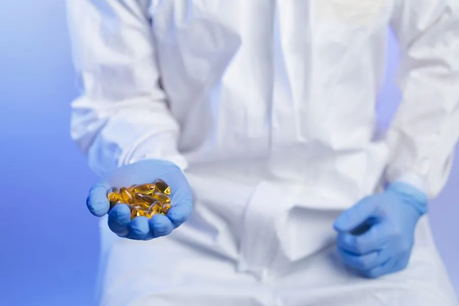 Person holding capsules